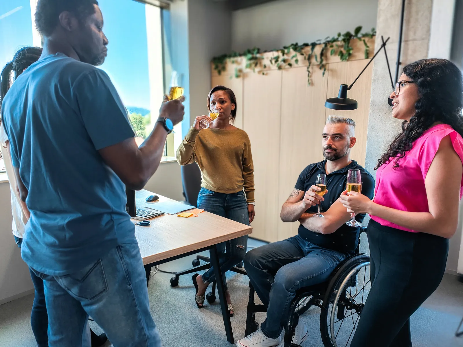 A diverse team celebrating the success of a project